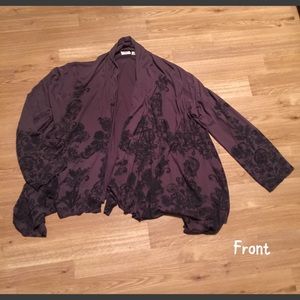 Jersey style cardigan with asymmetric hem.